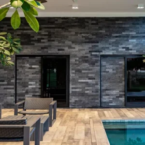 a pool with chairs and a tree