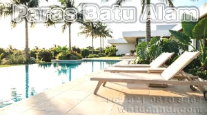 Beige sandstone and limestone wall and flooring tiles for tropical swimming pools from Indonesia featuring warm creamy tones and natural texture ideal for pool surrounds and water features