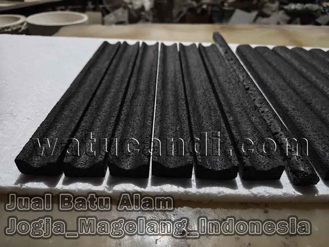 Detail of natural lava stone bamboo groove on washbasin and bathroom wall with calming tropical resort ambiance