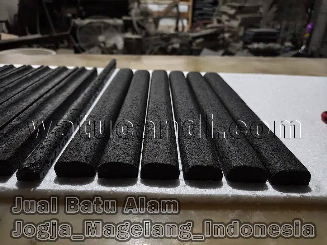 Detail of candi lava stone with round bamboo grooves on building pillars and columns in classic modern style